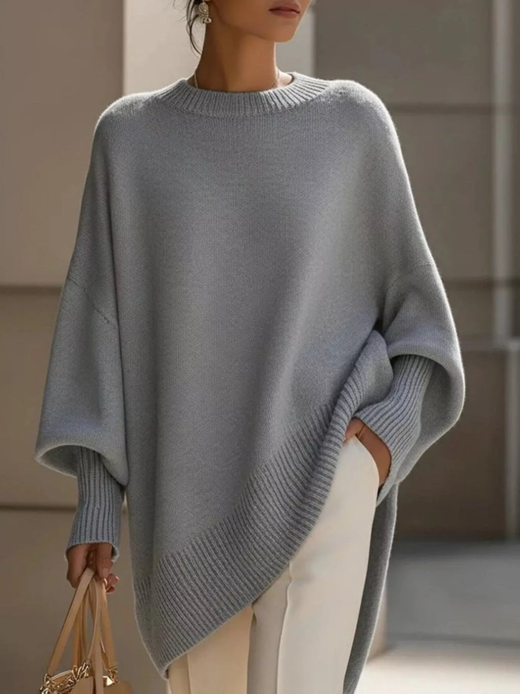 Jersey oversize de mujer con puños acanalados y bajo asimétrico