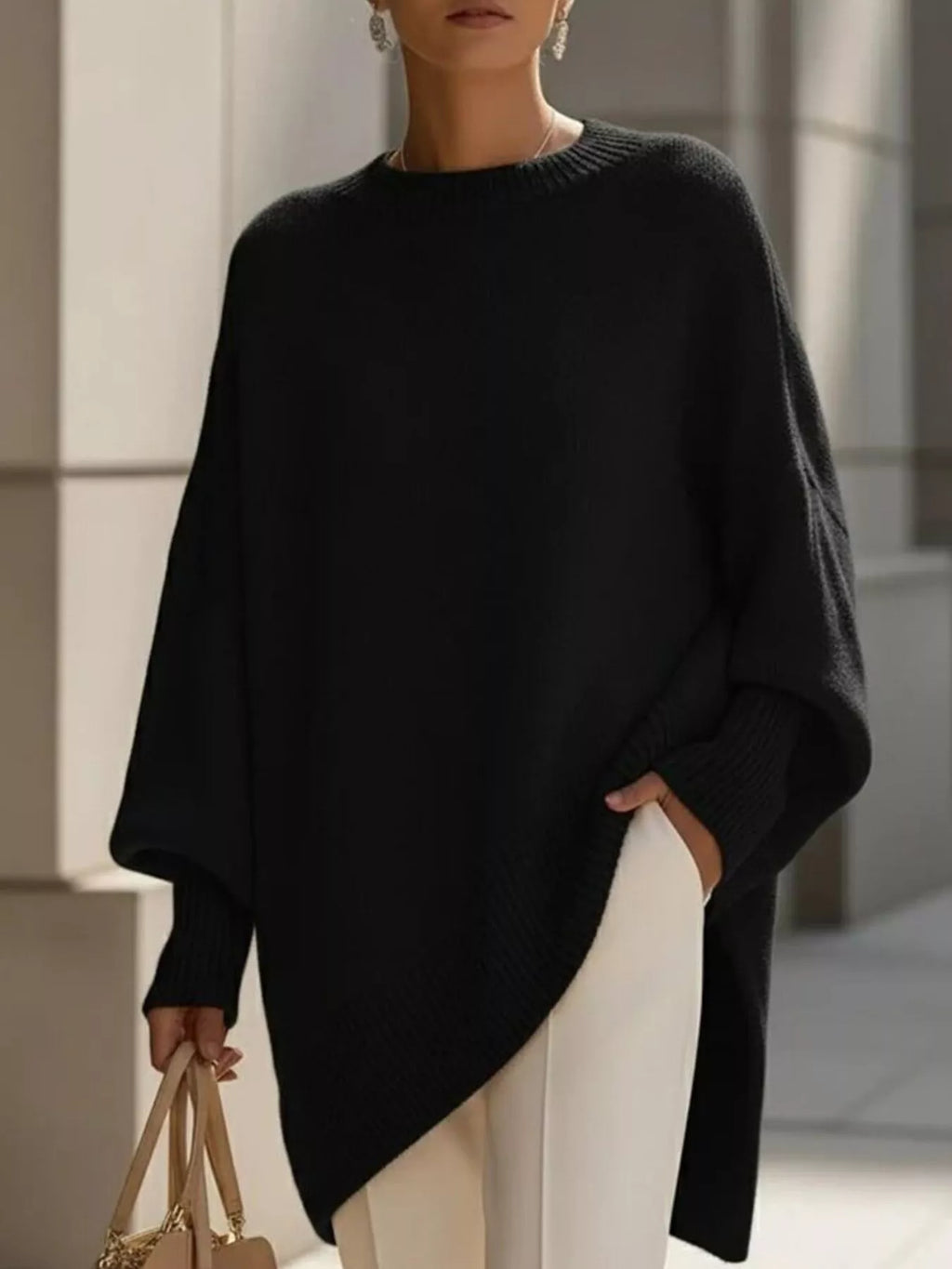 Jersey oversize de mujer con puños acanalados y bajo asimétrico