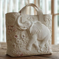 Beige taske til damer med relief af elefant og blomster