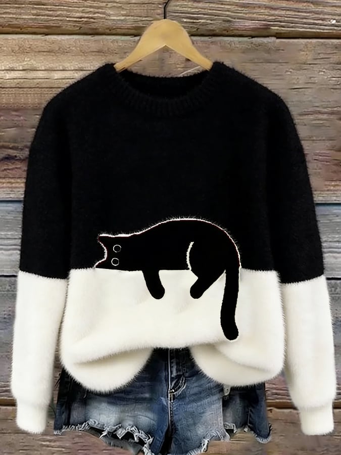 Damski sweter oversize z kontrastowym wzorem i czarnym motywem kota