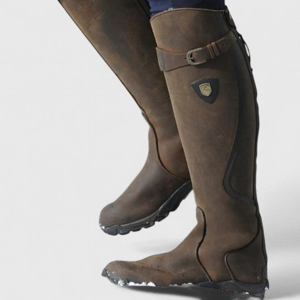 Botas de mulher até ao joelho com fivela e sola plana