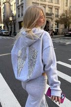 Sweatshirt com capuz de mulher com corte folgado e asas decorativas