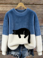 Damski sweter oversize z kontrastowym wzorem i czarnym motywem kota