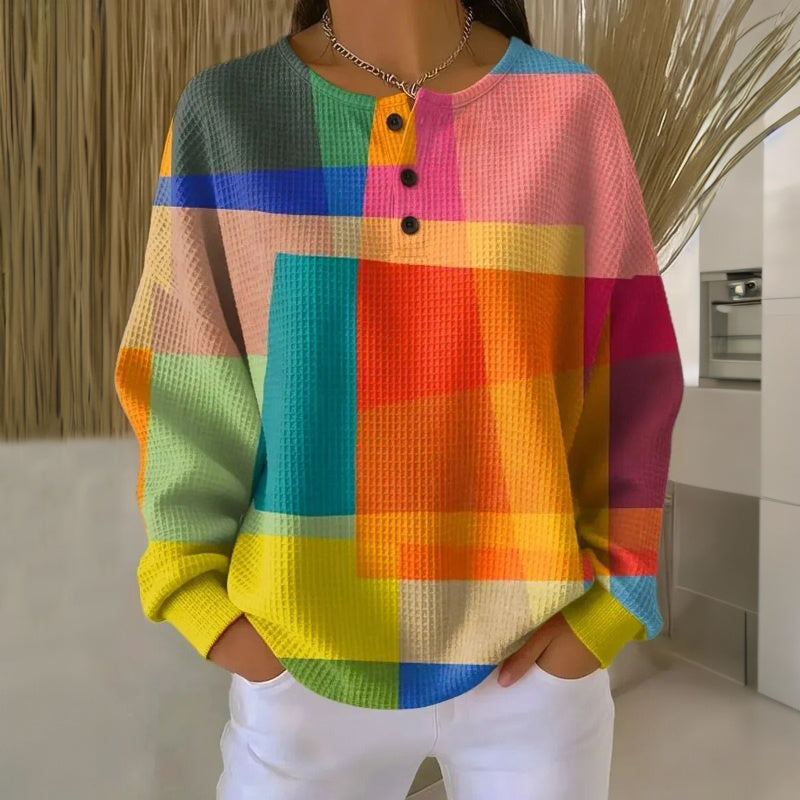 Damska bluza w wielokolorowe geometryczne bloki z guzikami