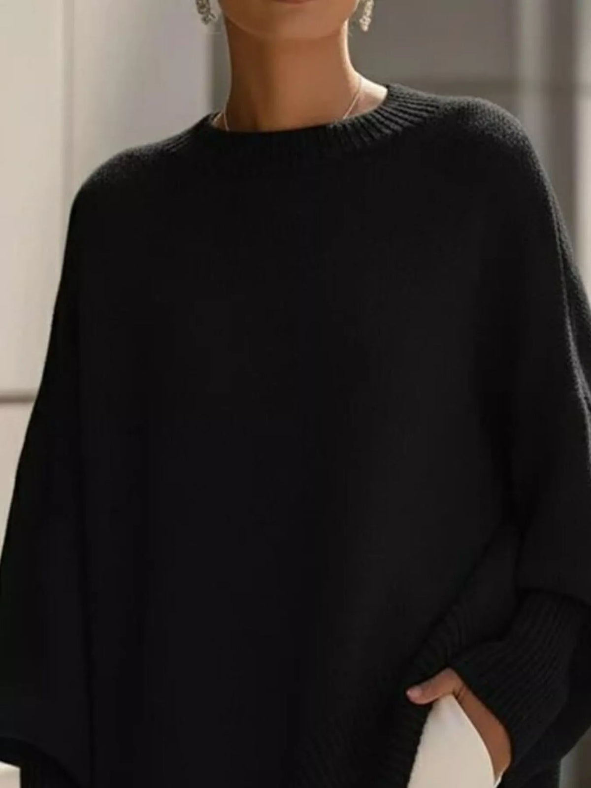 Pulover oversize de damă cu manșete striate și bază asimetrică