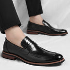 Mocassins penny de homem com costuras e salto baixo