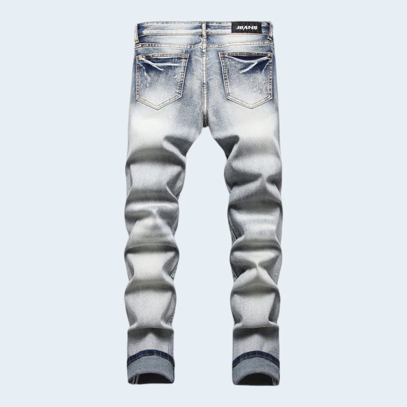 Férfi slim fit farmer kopott részekkel és felvarrókkal