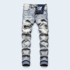 Férfi slim fit farmer kopott részekkel és felvarrókkal