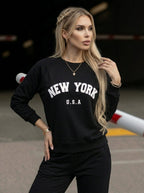 Czarna damska bluza z białym nadrukiem New York i długimi rękawami