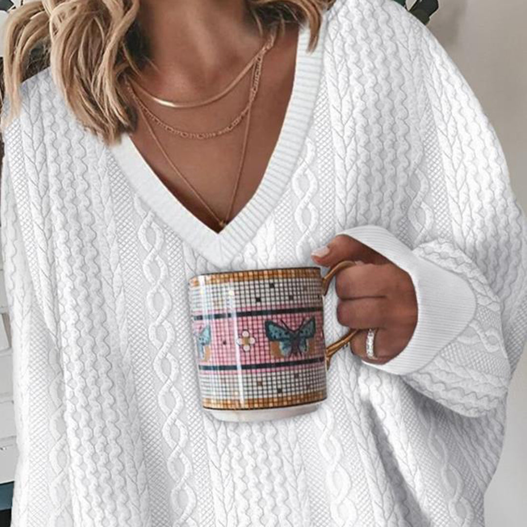 Pull femme blanc à col V et maille torsadée
