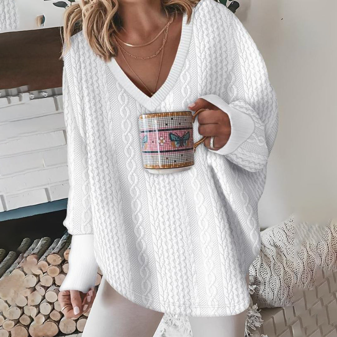 Pull femme blanc à col V et maille torsadée