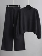 Conjunto de malha de mulher, camisola de decote redondo e calças largas