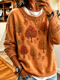 Sweatshirt laranja de mulher com estampado de árvores e flores e manga comprida