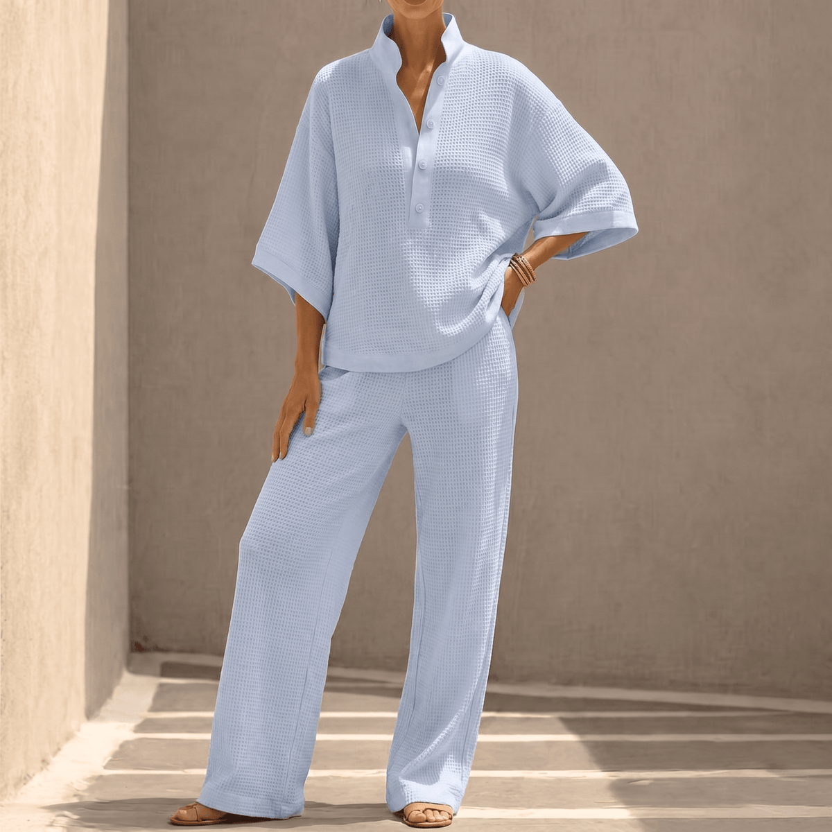 Completo donna in maglia con polo e pantaloni larghi